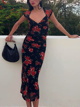 Midikleid mit Blumenmuster und gerüschter Seite